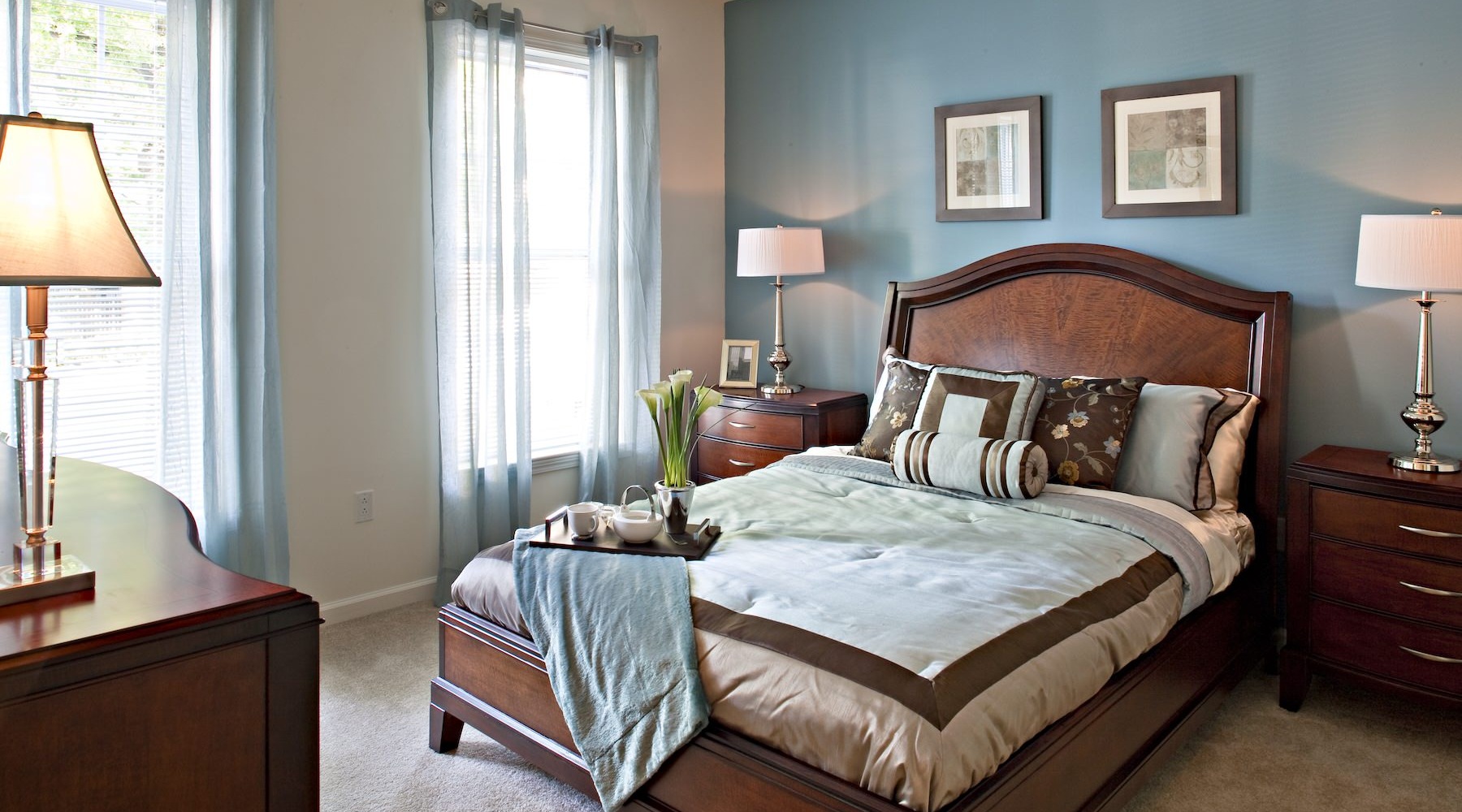 a bedroom with a bed and two nightstands