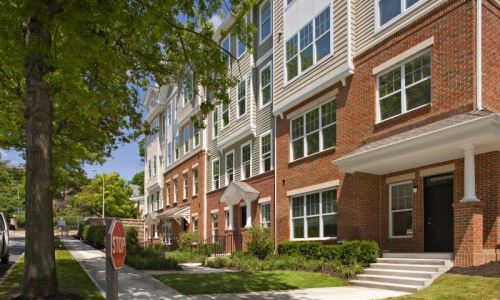 a brick building with a tree in front of it