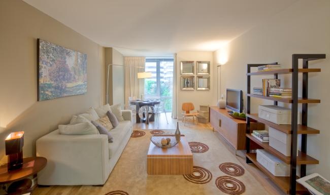 a living room with a large bookcase and a couch