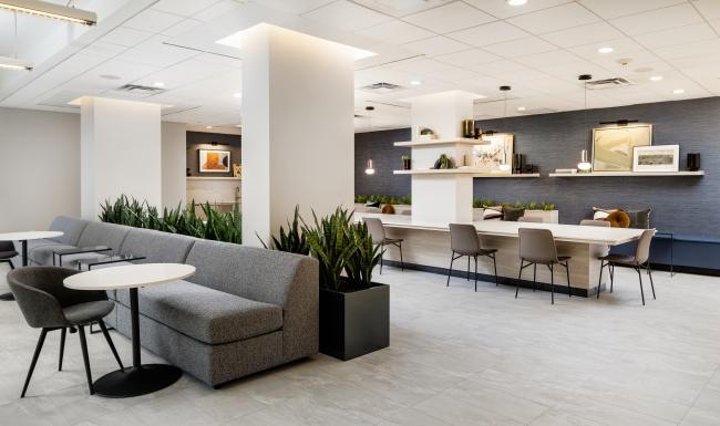 a room with a table, chairs and a couch